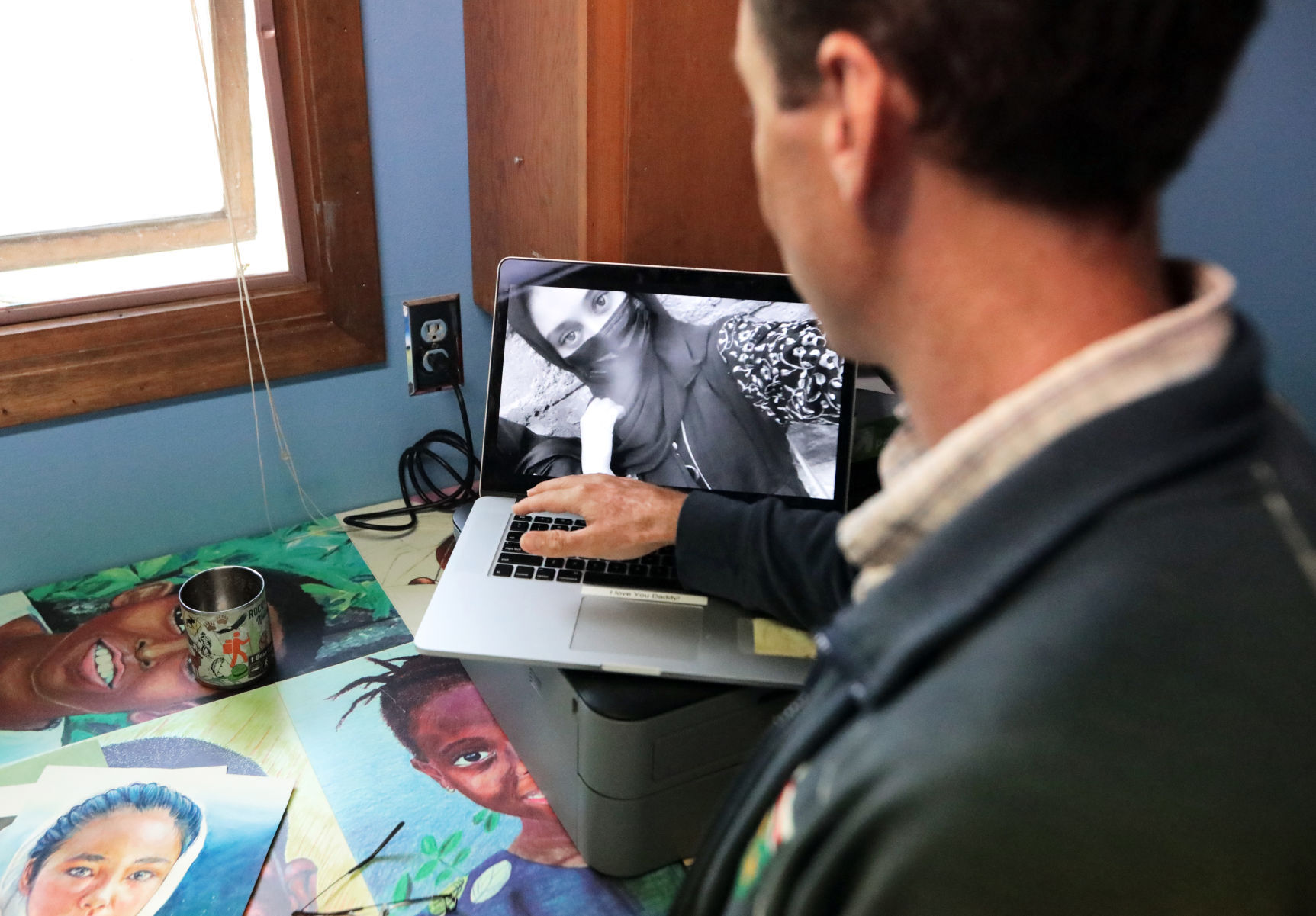 Ben Schumaker with photo of Roya